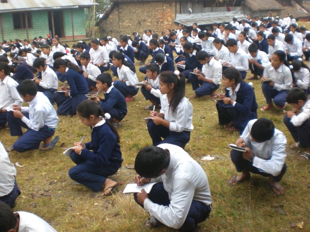 Children taking notes